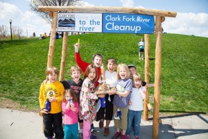 2015 Clark Fork River Cleanup - kids under CFC sign - Photo by Robin Carleton
