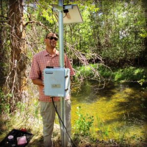 Jed installs a telemetry station to monitor real-time flows on Tin Cup Creek in the Bitterroot Watershed